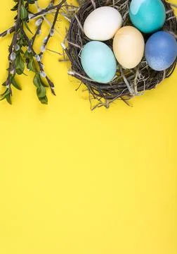 Colorful background with Easter eggs on yellow background. Happy Easter conce Stock Photos