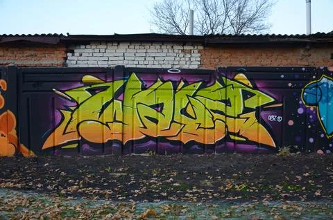 Colorful background of graffiti painting artwork with bright aerosol outlines on Stock Photos