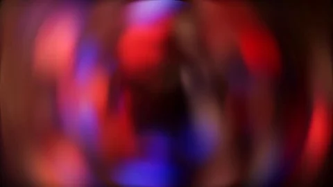 COLORFUL BACKGROUND AS SEEN THROUGH A GLASS OF LIQUID Stock Footage