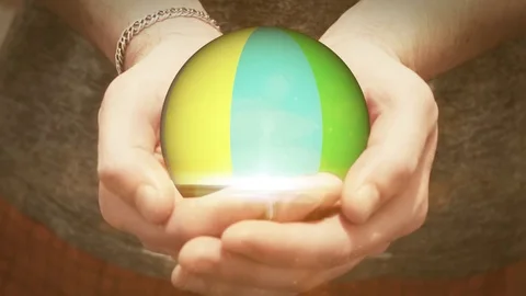 The colorful ball revolves in man hands Video stock 69859339