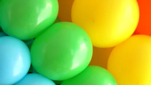 Colorful balloons arranged in vibrant patterns for fun activities during spring Stock Footage 314052180