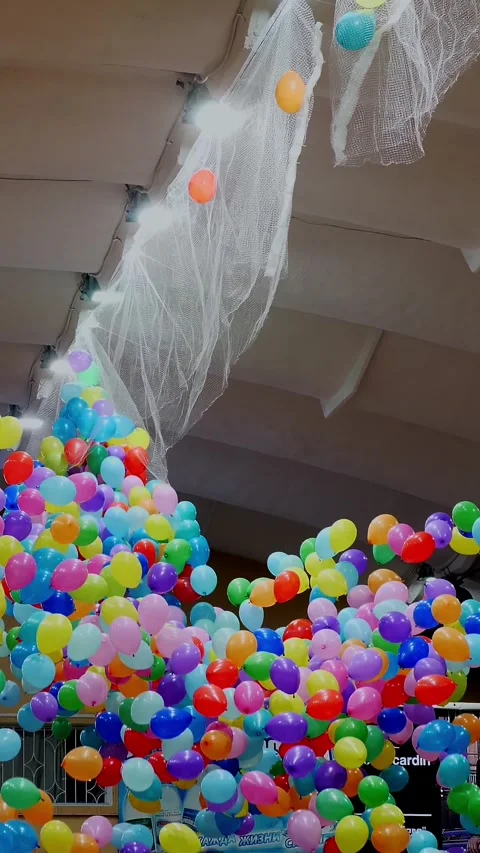 Colorful balloons falling from the ceiling, city event, holiday Stock Footage 319118183