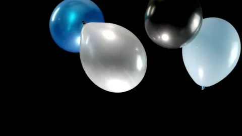 Colorful Balloons Falling from Top to Bottom in Slow Motion, Creating a Vibrant Stock Footage 304866466