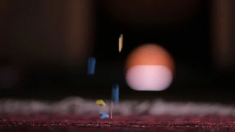 Colorful balls, beads fall to the floor in slow motion. Stock Footage 104004330