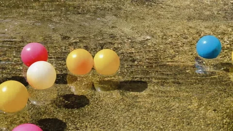 Colorful balls floating in the pool Stock Footage 286804818