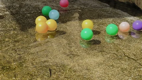 Colorful balls floating in the pool Stock Footage 290896978