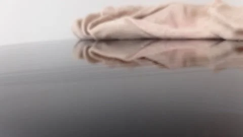 Colorful balls rolling on a brown table Stock Footage 146255337