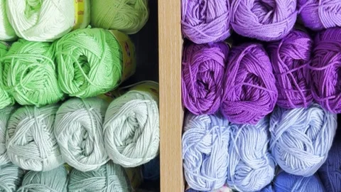 Colorful balls of wool on the shelf. Different balls of yarn of different colors Stock Footage 250112466