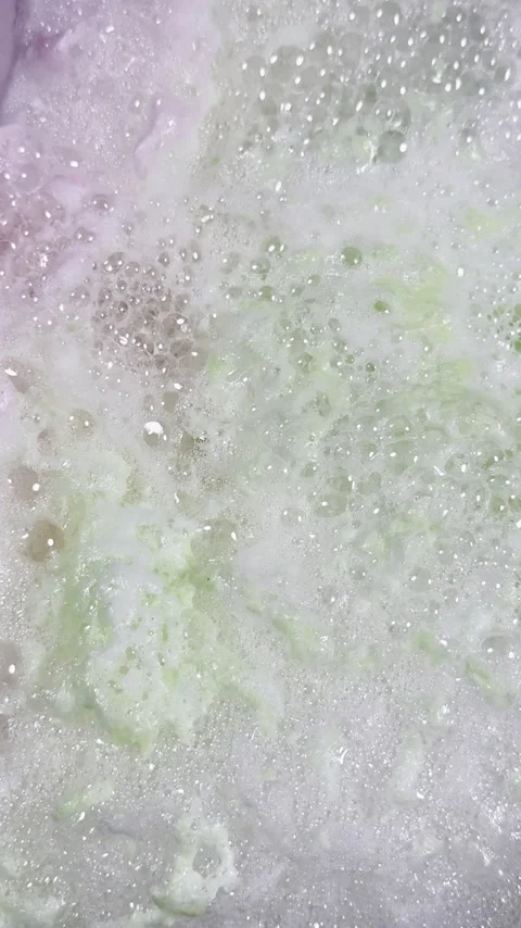 Colorful bath bomb bubbles pop creating unique background plate Stock Footage 334763145