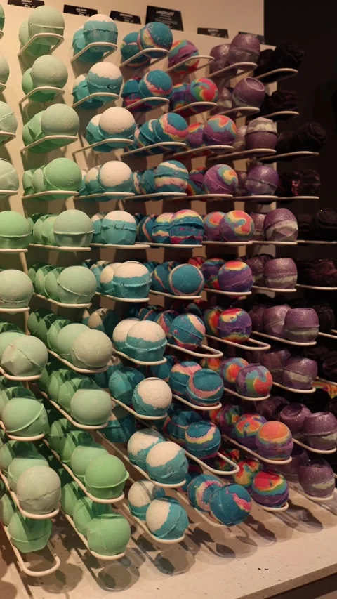 Colorful bath bombs rows on display shelves Vídeo Stock 332163732