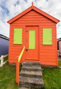 Colorful beach side huts on Devon coast of England Stock Photos