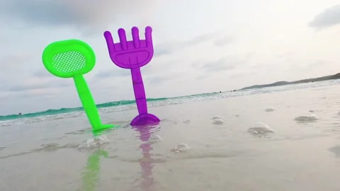 Colorful Beach toys on sea beach, footage video Stock Footage