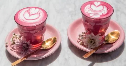 Colorful beetroot super latte on marble background Stock Photos