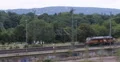 Colorful Big Heavy Shunt Diesel Locomotive Passing Railway Station Yard Maneuver 4k or 4k+ Resolution