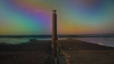 Colorful Big wave crashing into pier rock in slow motion Stock Footage
