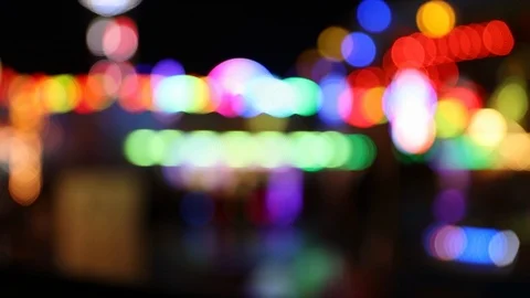 Colorful blinking defocused carnival lights at night Stock Footage 120138277