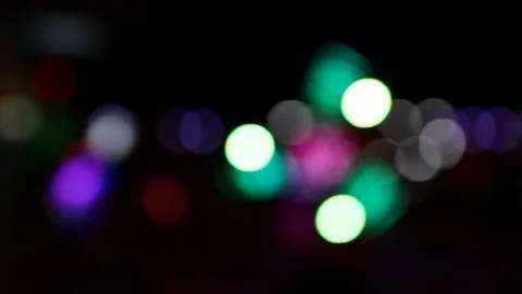 Colorful blurry lights of a moving carousel ride at night Stock Footage 123071090