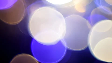 Colorful bokeh effect created by blurred city lights at night Stock Footage 310042969