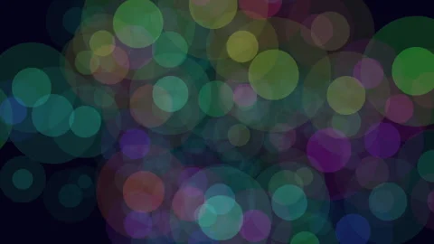 Colorful bokeh light circles moving on dark background abstract party backdrop 库存影片 334139701