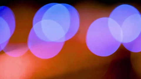Colorful bokeh lights background. Vibrant purple and blue circles on dark Stock Footage 334302571