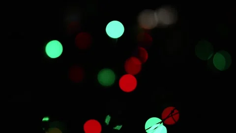 Colorful Bokeh Lights on Dark Background, Abstract image of colorful bokeh .. Видео 304910801