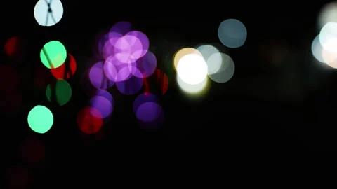 Colorful Bokeh Lights on Dark Background, Abstract image of colorful bokeh .. Vídeo Stock 304910890