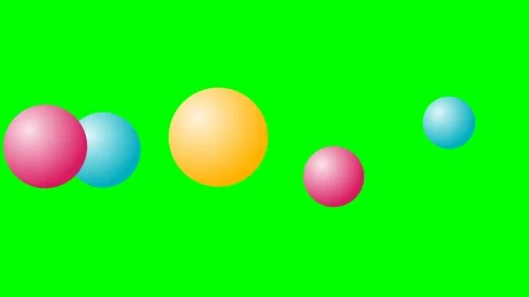 Colorful bouncing spheres floating on a bright green chroma key background Stock Footage 339925438
