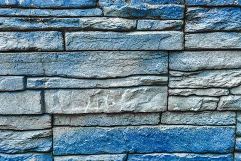 Colorful brick wall pattern from blue stones Stock Photos