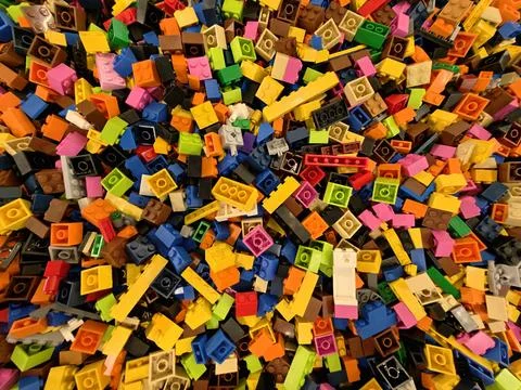 Colorful Bricks Spread Out In Explosive Pattern Suitable For Engaging Stockfoto's