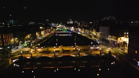 Colorful Bridge Lights Reflecting on Dublin's River at Night Stock Footage 332444806