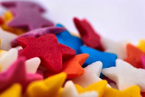 Colorful bright background, multi-colored stars. Sweet nice background candy. Stock Photos