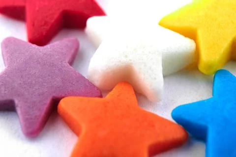 Colorful bright background, multi-colored stars. Sweet nice background candy. Stock Photos