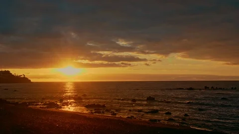 Colorful bright dramatic sunset, dawn on the ocean. The sun rises from beyond Video stock 122012513