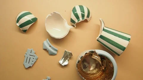 Colorful broken pottery on a flat surface Stock Footage 344024325