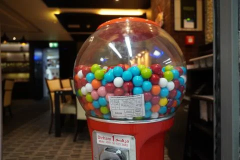 Colorful bubble gum in Coin operated gumball machine. Carousel Gumball Machin Stock Photos