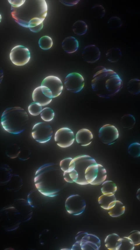 Colorful bubbles of different sizes float in darkness Stock Footage 312387573