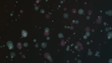Colorful bubbles drift and float against a dark, atmospheric backdrop Stock Footage 327337596