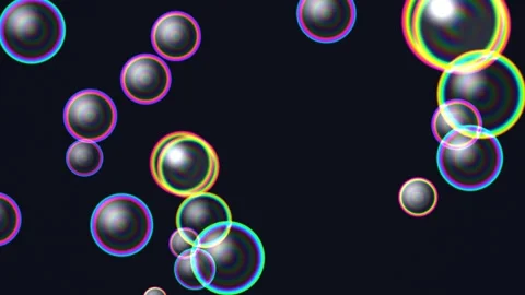 Colorful bubbles floating on a dark background in a dynamic pattern Stock Footage 339043446