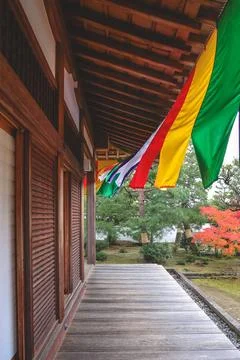 Colorful Buddhist Flags Draped Over a Traditional Temple Porch i Nov 28 2025 Fotos Stock