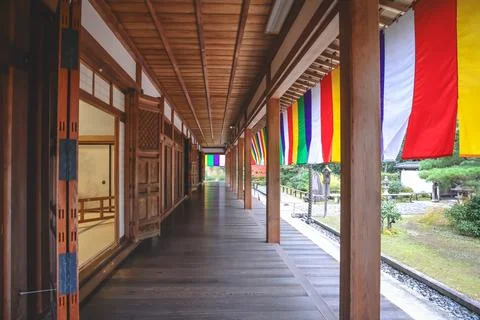 Colorful Buddhist Flags Draped Over a Traditional Temple Porch i Nov 28 2025 Fotos Stock