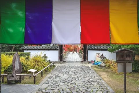 Colorful Buddhist Flags Draped Over a Traditional Temple Porch i Nov 28 2025 Fotos Stock