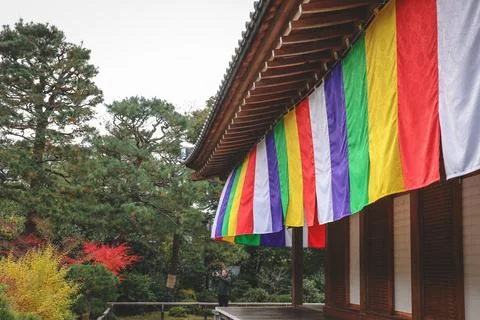 Colorful Buddhist Flags Draped Over a Traditional Temple Porch i Nov 28 2025 Fotos Stock