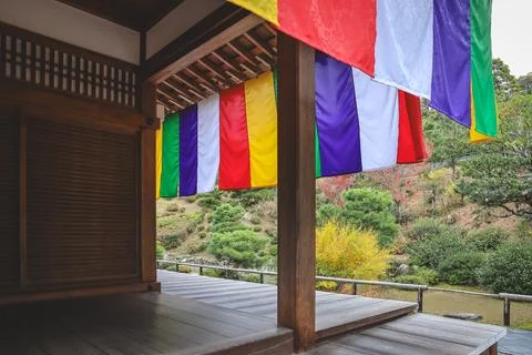 Colorful Buddhist Flags Draped Over a Traditional Temple Porch i Nov 28 2025 Fotos Stock