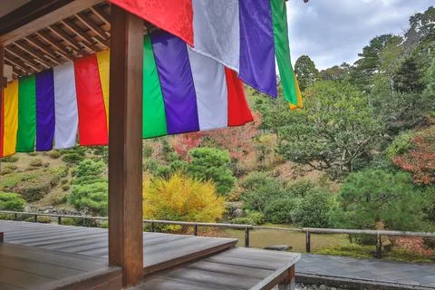 Colorful Buddhist Flags Draped Over a Traditional Temple Porch i Nov 28 2025 Fotos Stock