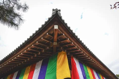 Colorful Buddhist Flags Draped Over a Traditional Temple Porch i Nov 28 2025 Fotos Stock
