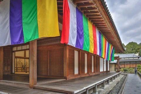 Colorful Buddhist Flags Draped Over a Traditional Temple Porch i Nov 28 2025 Fotos Stock