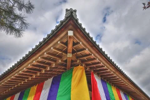 Colorful Buddhist Flags Draped Over a Traditional Temple Porch i Nov 28 2025 Fotos Stock