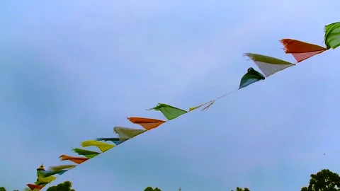 Colorful Buddhist prayer flags are flying in the open sky Stock Footage 150121131