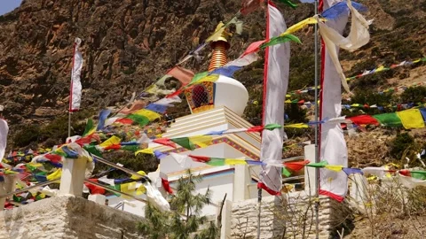 Colorful Buddhist prayer flags fluttering in the wind in Manang Village, Nepal Stock Footage 337514088