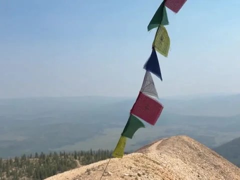 Colorful Buddhist Prayer Flags Fluttering on Mountain Peak Stock Footage 339880161